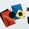 Vibrant geometric collage featuring colorful paper sheets and shapes creating abstract art.